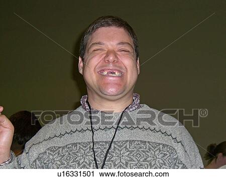 A man smiles for the camera, while at a medical conference. View Large Photo Image Stock Image - A man smiles for the camera, while at a medical conference.. Fotosearch