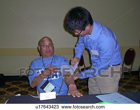 A man teaches a man how to read his blood pressure. View Large Photo Image Stock Image - A man teaches a man how to read his blood pressure.. Fotosearch