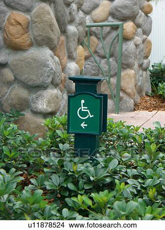 Handicap ramp sign at an amusement park. View Large Photo Image Picture - Handicap ramp sign at an amusement park.. Fotosearch