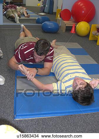 Stretches for physical therapy. View Large Photo Image Picture - Stretches for physical therapy.. Fotosearch