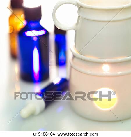 Picture - Aromatherapy oils and burner. Fotosearch
