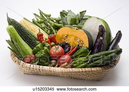 Stock Photography - Assorted vegetables in basket, white background. Fotosearch