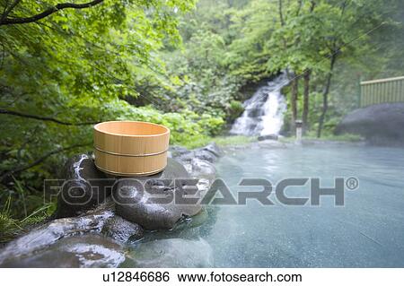 Bamboo bucket next to a forest hot spring View Large Photo Image Stock Photograph - Bamboo bucket next to a forest hot spring. Fotosearch