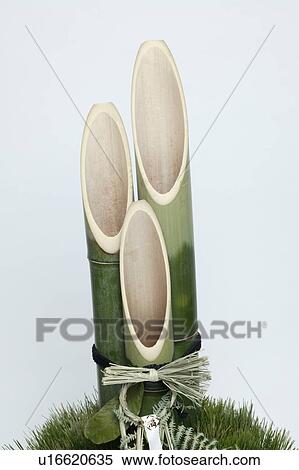Bamboo shoots tied into a decoration View Large Photo Image Stock Photography - Bamboo shoots tied into a decoration. Fotosearch