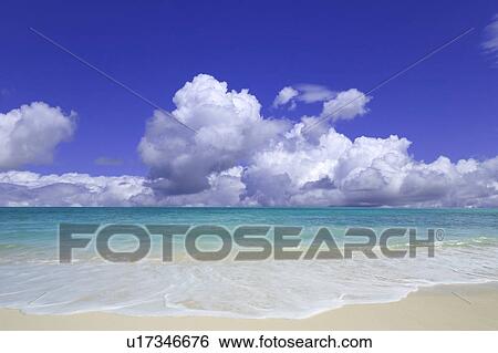 Stock Photograph - Beach and clouds. Hawaii, USA. Fotosearch