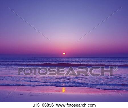 Stock Photograph - Beach at sunset with beautiful purple sky. Shizuoka Prefecture, Japan. Fotosearch