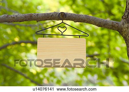 Blank sign hanging from a tree View Large Photo Image Stock Image - Blank sign hanging from a tree. Fotosearch