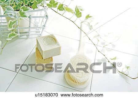 Stock Image - Body brush and soap in bathroom. Fotosearch