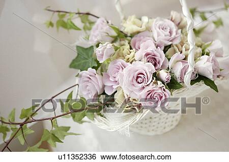 Stock Photograph - Bouquet in a basket. Fotosearch