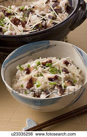 Stock Photograph - Bowl of rice cooked with slices of octopus. Fotosearch