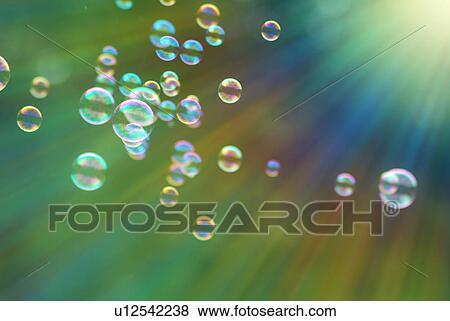 Stock Photo - Bubbles floating towards the sun. Fotosearch