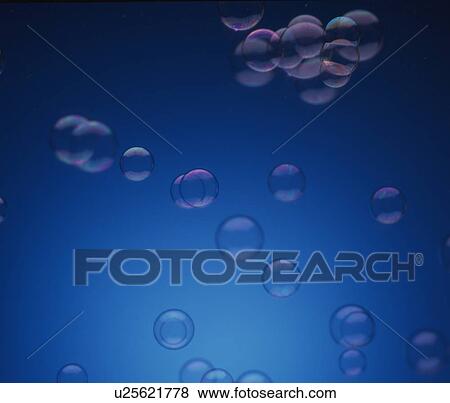 Stock Photo - Bubbles on blue background. Fotosearch
