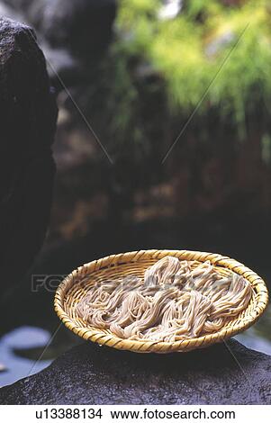 Picture - Buckwheat noodles in a basket. Fotosearch