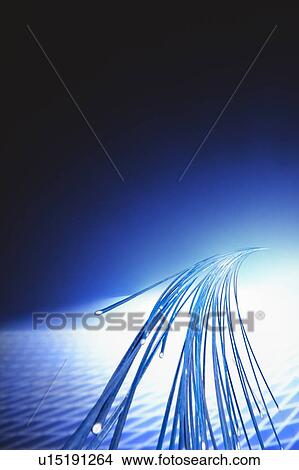 Picture - Bunch of fiber optics, computer graphic, black background. Fotosearch