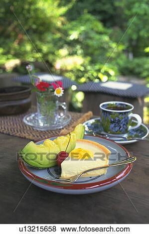 Cake and tea at a garden cafe View Large Photo Image Stock Photo - Cake and tea at a garden cafe. Fotosearch