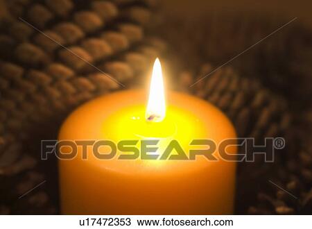 Stock Image - Candle burning. Fotosearch