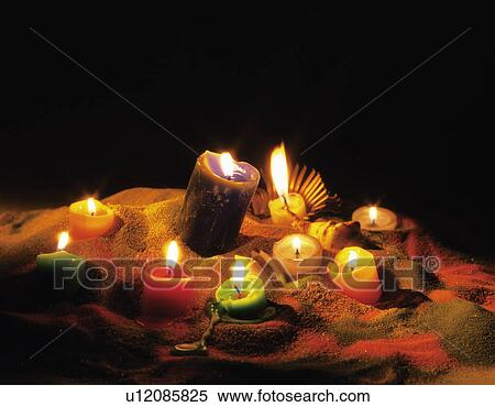 Candles melting onto sand View Large Photo Image Stock Photography - Candles melting onto sand. Fotosearch