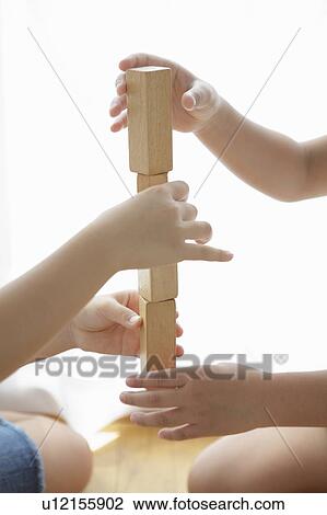 Children playing with wooden blocks View Large Photo Image Stock Image - Children playing with wooden blocks. Fotosearch