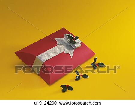 Christmas gift box decorated with holly View Large Photo Image Stock Image - Christmas gift box decorated with holly. Fotosearch