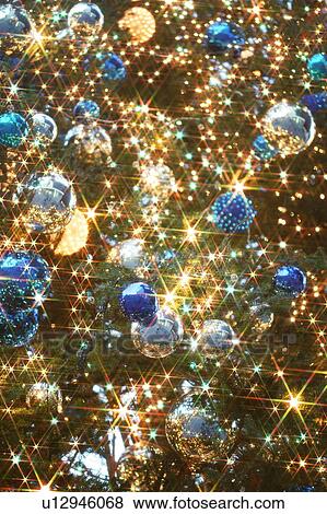 Stock Photo - Christmas tree with blue and silver baubles. Fotosearch