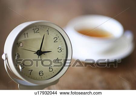 Picture - Clock indicating tea time. Fotosearch