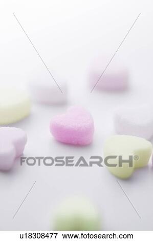 Close up of heart shaped sugar cubes, white background View Large Photo Image Stock Photo - Close up of heart shaped sugar cubes, white background. Fotosearch