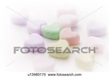 Close up of heart shaped sugar cubes, white background View Large Photo Image Stock Photography - Close up of heart shaped sugar cubes, white background. Fotosearch
