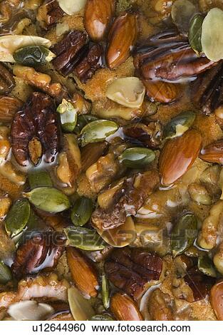 Stock Image - Close up of nut tart, full frame. Fotosearch
