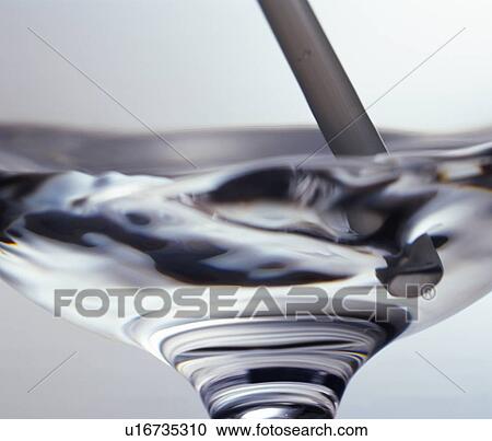 Close up of water being stirred in a wineglass View Large Photo Image Stock Image - Close up of water being stirred in a wineglass. Fotosearch