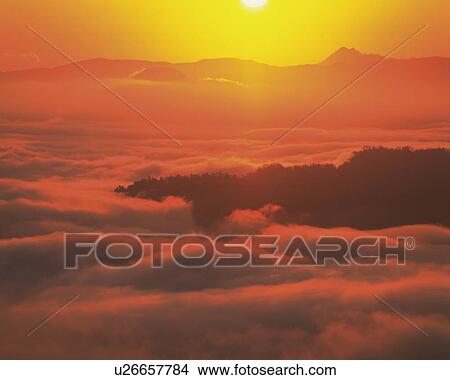 Picture - Clouds over sea at sunrise, Tsubetsu-machi, Hokkaido, Japan. Fotosearch