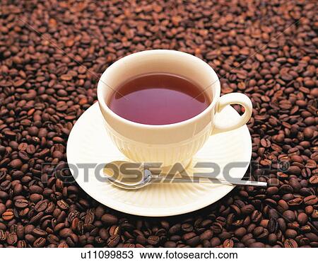 Coffee cup on top of coffee beans View Large Photo Image Stock Image - Coffee cup on top of coffee beans. Fotosearch