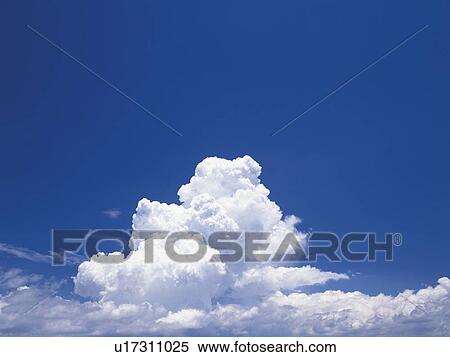 Stock Photography - Cumulonimbus clouds in a blue sky. Fotosearch