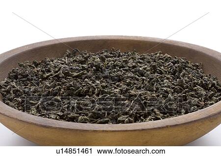 Stock Image - Dried Tea Leaves of Oolong Tea in Bowl. Fotosearch