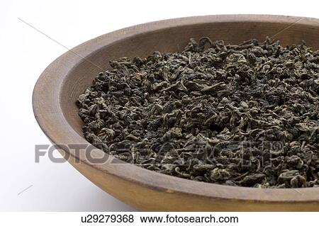 Stock Photo - Dried Tea Leaves of Oolong Tea in Bowl. Fotosearch