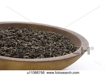 Stock Photograph - Dried Tea Leaves of Oolong Tea in Bowl. Fotosearch