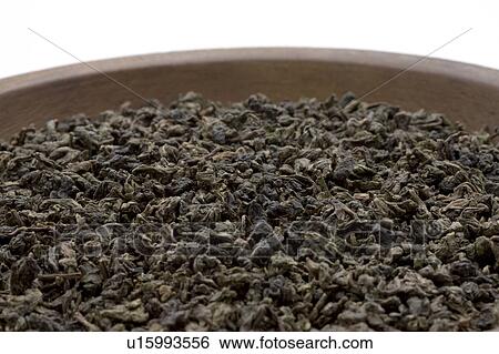 Stock Photograph - Dried Tea Leaves of Oolong Tea in Bowl. Fotosearch