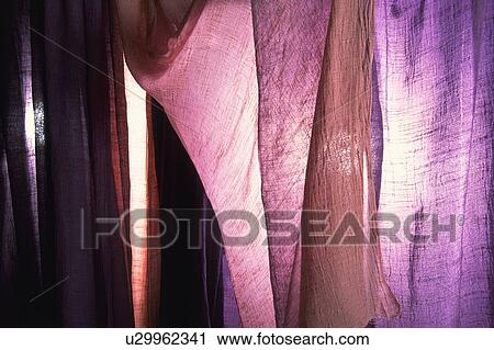 Dyed purple cloth hanging over a window View Large Photo Image Stock Image - Dyed purple cloth hanging over a window. Fotosearch