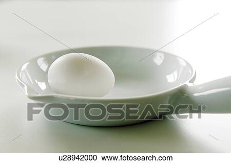 Stock Image - Egg in a dish. Fotosearch