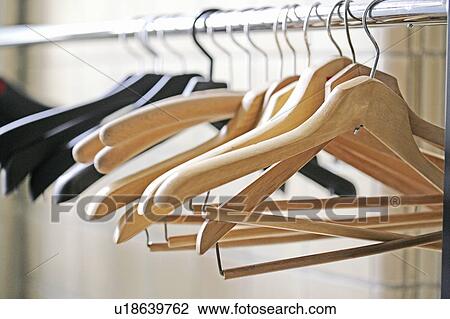 Stock Image - Empty coat hangers. Fotosearch