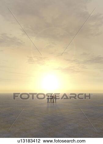 Stock Image - Family standing in desert. Fotosearch