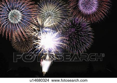 Picture - Fireworks exploding in night sky. Fotosearch
