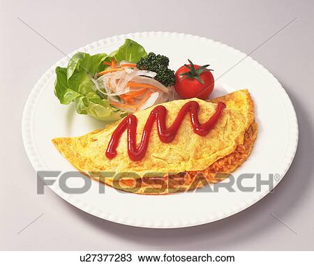 Stock Image - Fried rice omelette with fresh salad and tomato sauce. Fotosearch