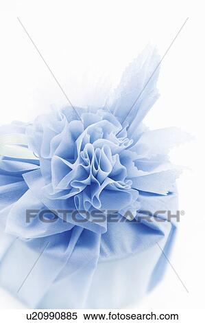 Stock Photography - Gift wrapped in blue fabric. Fotosearch