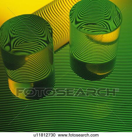 Stock Image - Glass objects on green and black stripes. Fotosearch