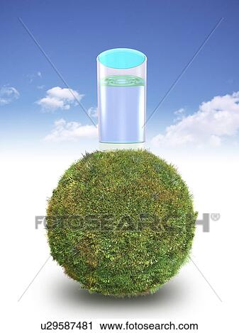 Stock Image - Glass of water on grass covered sphere. Fotosearch