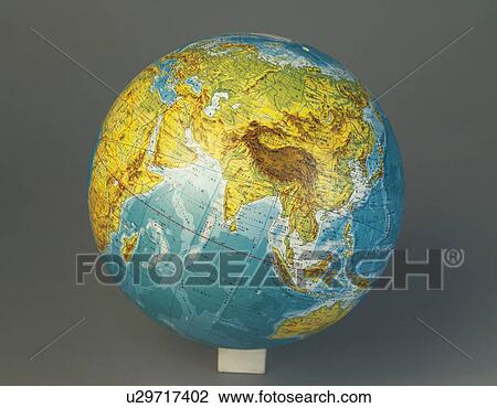 Stock Image - Globe on gray background. Fotosearch