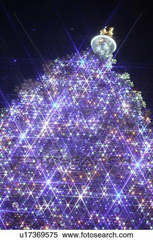 Stock Photography - Glowing Christmas tree topped with a disco ball, Odaiba, Minato-ku, Japan. Fotosearch