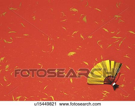 Gold fan on red and gold background View Large Photo Image Stock Image - Gold fan on red and gold background. Fotosearch