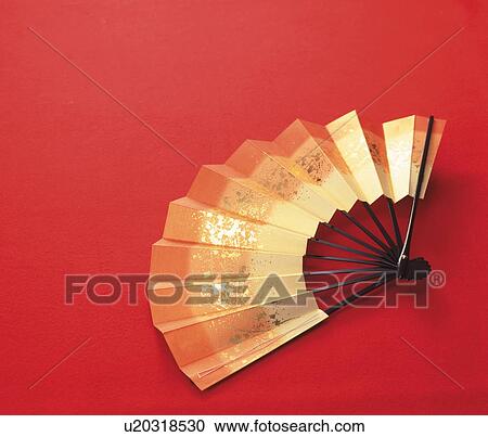 Stock Image - Gold Japanese fan. Fotosearch