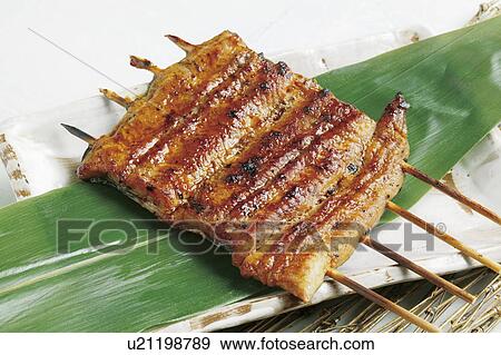 Grilled eel on skewers View Large Photo Image Stock Photo - Grilled eel on skewers. Fotosearch